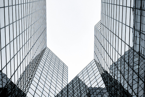 Looking up at glass skyscrapers